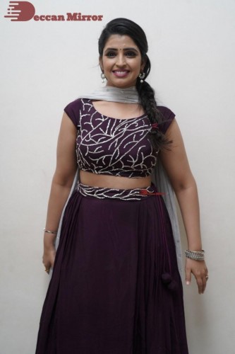 TV Anchor Syamala poses for pictures in a purple dress