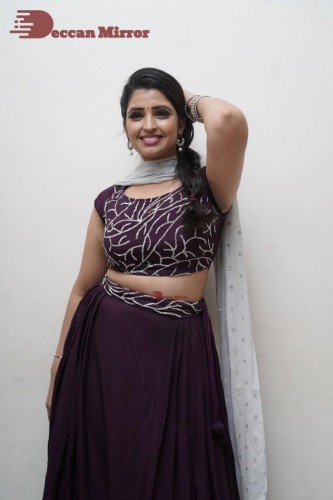 TV Anchor Syamala poses for pictures in a purple dress
