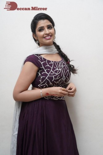 TV Anchor Syamala poses for pictures in a purple dress