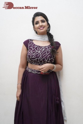 TV Anchor Syamala poses for pictures in a purple dress