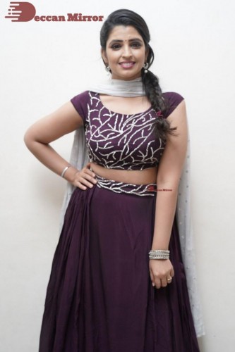 TV Anchor Syamala poses for pictures in a purple dress