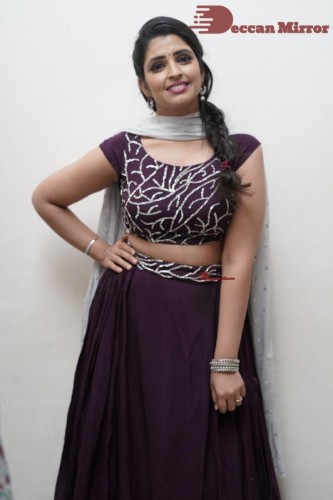 TV Anchor Syamala poses for pictures in a purple dress
