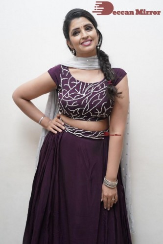 TV Anchor Syamala poses for pictures in a purple dress