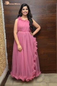 Anchor Syamala in a pink dress