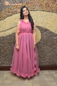Anchor Syamala in a pink dress