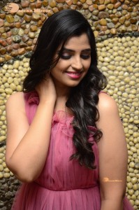 Anchor Syamala in a pink dress