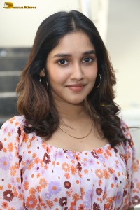 actress anikha surendran in a pink and white floral dress