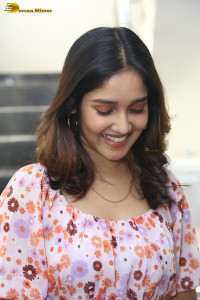actress anikha surendran in a pink and white floral dress