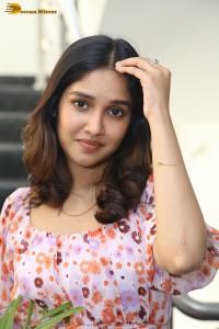 actress anikha surendran in a pink and white floral dress