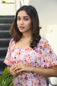 actress anikha surendran in a pink and white floral dress