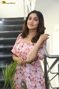 actress anikha surendran in a pink and white floral dress
