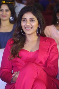 actress Anjali stylish in a red suit at a movie event