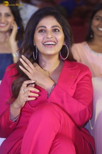 actress Anjali stylish in a red suit at a movie event