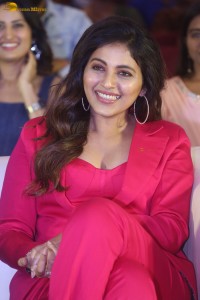 actress Anjali stylish in a red suit at a movie event