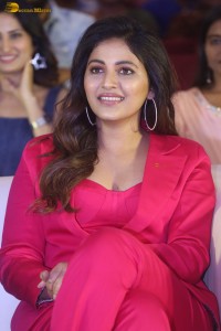 actress Anjali stylish in a red suit at a movie event
