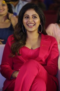 actress Anjali stylish in a red suit at a movie event