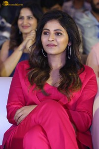 actress Anjali stylish in a red suit at a movie event