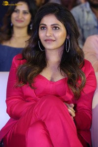 actress Anjali stylish in a red suit at a movie event
