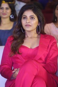 actress Anjali stylish in a red suit at a movie event