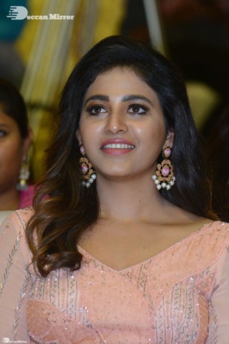 Telugu and Tamil Actress Anjali at a cinema event in light orange dress