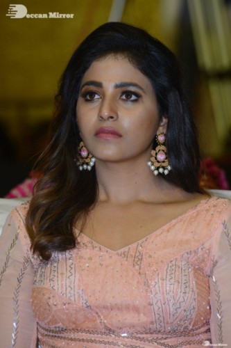 Telugu and Tamil Actress Anjali at a cinema event in light orange dress