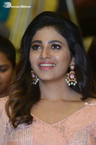 Telugu and Tamil Actress Anjali at a cinema event in light orange dress