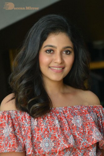 Telugu and Tamil Actress Anjali poses for pictures in Orange Off Shoulder Top and Jeans