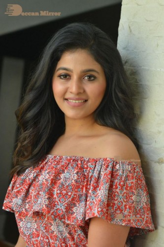 Telugu and Tamil Actress Anjali poses for pictures in Orange Off Shoulder Top and Jeans