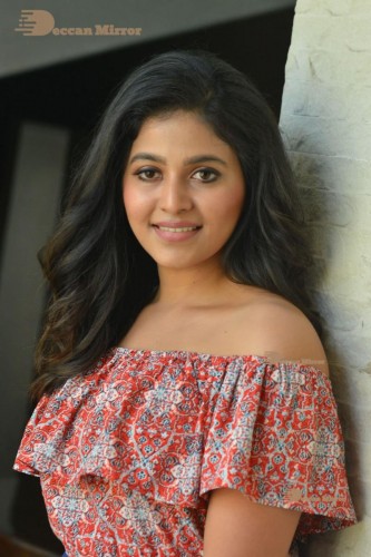 Telugu and Tamil Actress Anjali poses for pictures in Orange Off Shoulder Top and Jeans