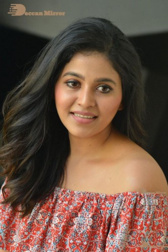Telugu and Tamil Actress Anjali poses for pictures in Orange Off Shoulder Top and Jeans