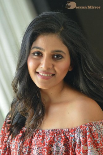 Telugu and Tamil Actress Anjali poses for pictures in Orange Off Shoulder Top and Jeans