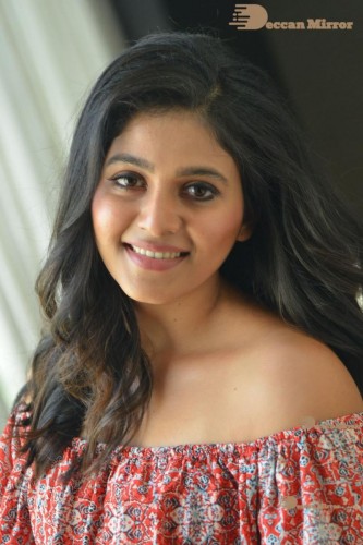 Telugu and Tamil Actress Anjali poses for pictures in Orange Off Shoulder Top and Jeans