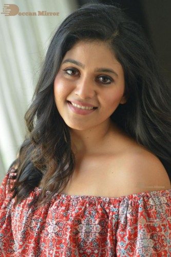 Telugu and Tamil Actress Anjali poses for pictures in Orange Off Shoulder Top and Jeans