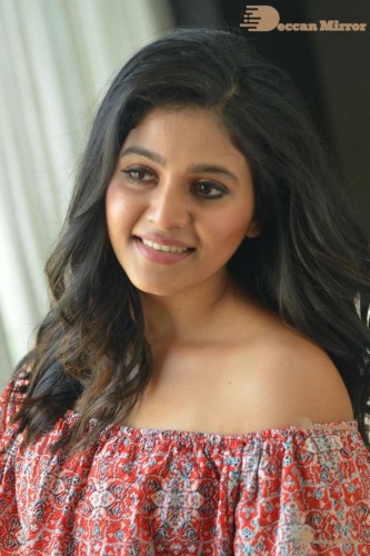 Telugu and Tamil Actress Anjali poses for pictures in Orange Off Shoulder Top and Jeans