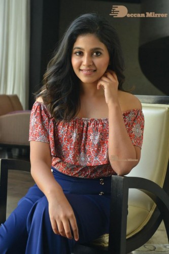 Telugu and Tamil Actress Anjali poses for pictures in Orange Off Shoulder Top and Jeans