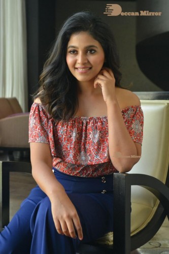 Telugu and Tamil Actress Anjali poses for pictures in Orange Off Shoulder Top and Jeans