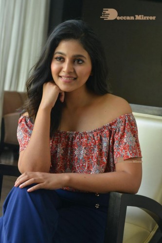 Telugu and Tamil Actress Anjali poses for pictures in Orange Off Shoulder Top and Jeans