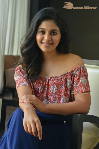 Telugu and Tamil Actress Anjali poses for pictures in Orange Off Shoulder Top and Jeans