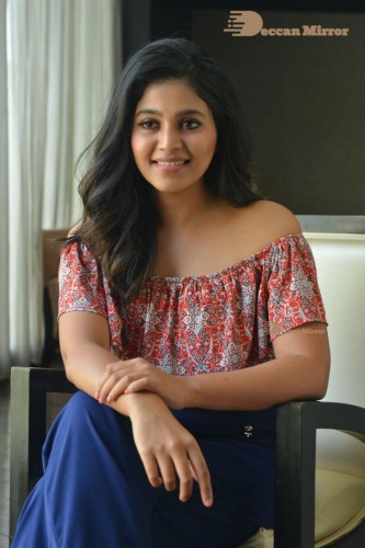 Telugu and Tamil Actress Anjali poses for pictures in Orange Off Shoulder Top and Jeans