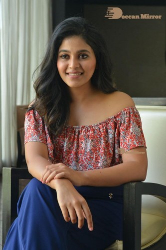 Telugu and Tamil Actress Anjali poses for pictures in Orange Off Shoulder Top and Jeans