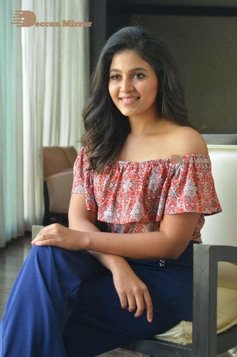 Telugu and Tamil Actress Anjali poses for pictures in Orange Off Shoulder Top and Jeans