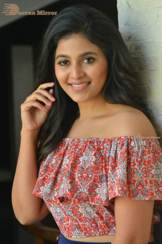 Telugu and Tamil Actress Anjali poses for pictures in Orange Off Shoulder Top and Jeans