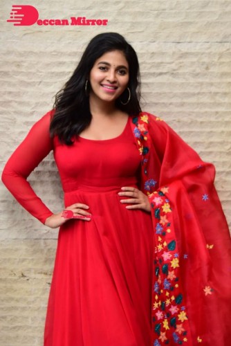 Tamil and Telugu Actress Anjali looks cute as she poses for pictures in a Red Salwar Kameez