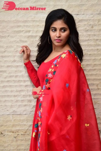 Tamil and Telugu Actress Anjali looks cute as she poses for pictures in a Red Salwar Kameez