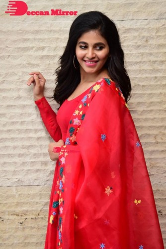 Tamil and Telugu Actress Anjali looks cute as she poses for pictures in a Red Salwar Kameez