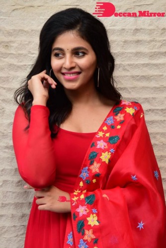 Tamil and Telugu Actress Anjali looks cute as she poses for pictures in a Red Salwar Kameez