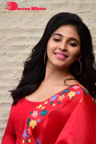 Tamil and Telugu Actress Anjali looks cute as she poses for pictures in a Red Salwar Kameez