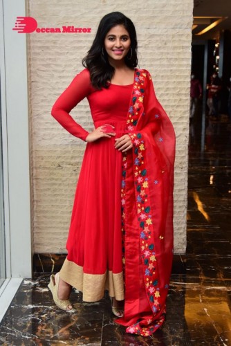 Tamil and Telugu Actress Anjali looks cute as she poses for pictures in a Red Salwar Kameez