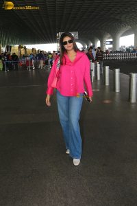 Indian actress and social media influencer anjali arora cute in a pink shirt and denim jeans