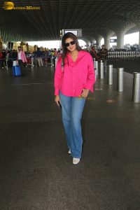 Indian actress and social media influencer anjali arora cute in a pink shirt and denim jeans